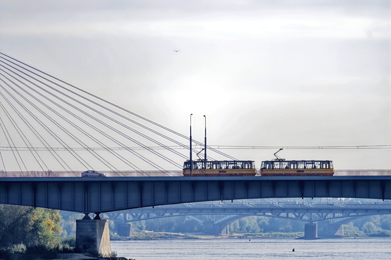 18 - A transit tram crossing the Poniatowski Bridge over the Vistula River in Warsaw, Poland